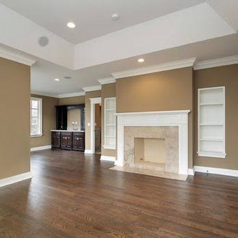 Freshly painted living room with crown molding and trim work