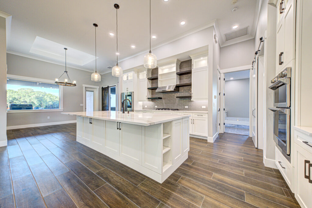 Modern kitchen with cabinetry, island, and fixtures
