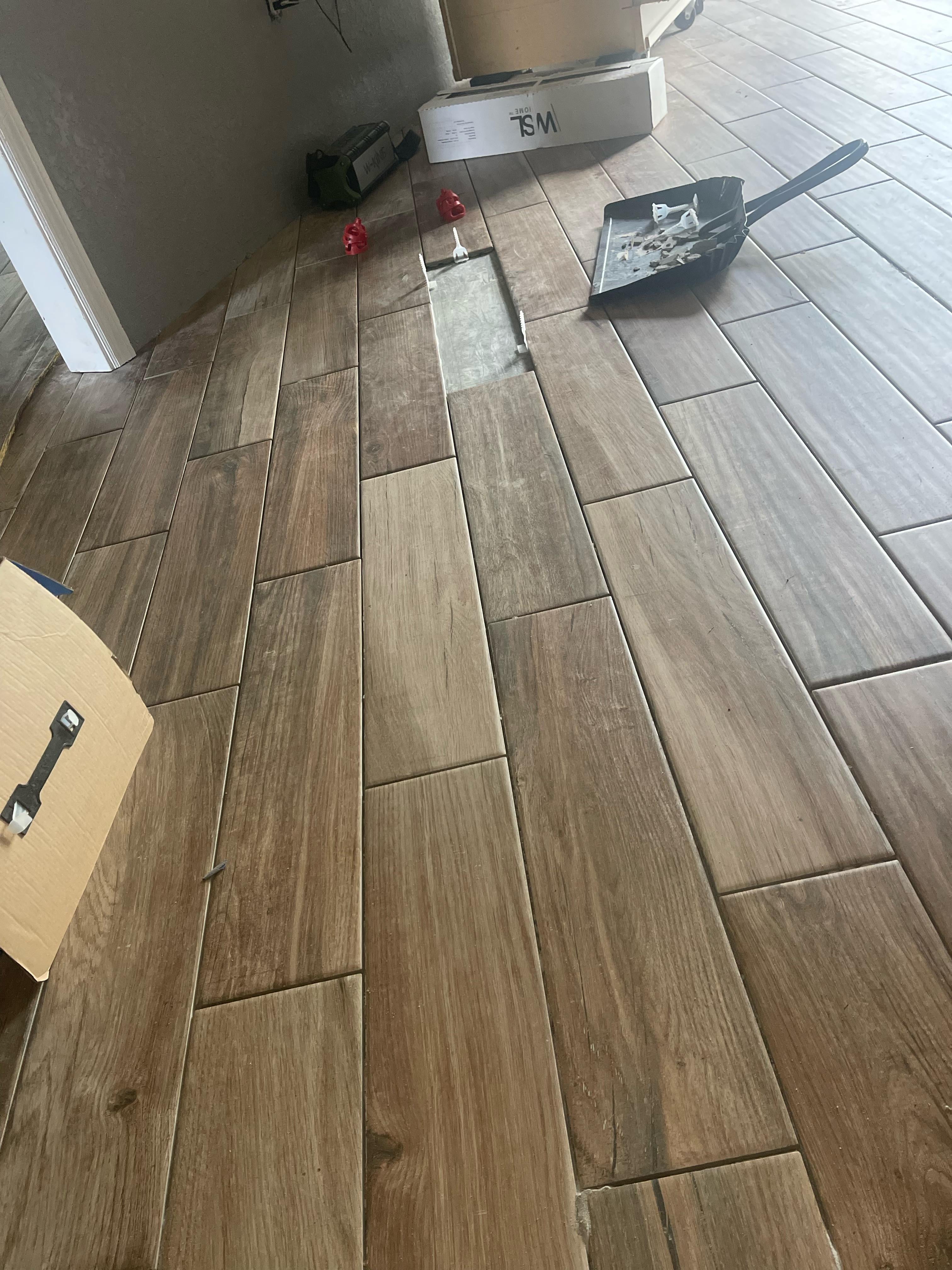 Wood-look plank flooring installation in progress
